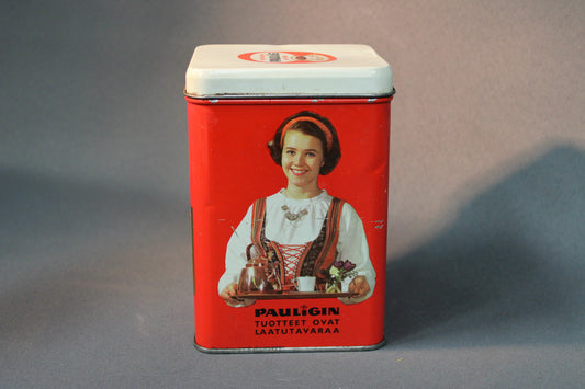 Pauligin vintage-peltipurkki punaisella pohjalla ja tarjoilijatar-kuvalla